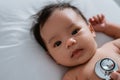 Little baby while examined by doctor Royalty Free Stock Photo