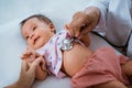 Little baby while examined by doctor Royalty Free Stock Photo