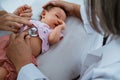 Little baby while examined by doctor Royalty Free Stock Photo