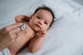 Little baby while examined by doctor Royalty Free Stock Photo