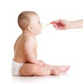 Little baby feeding with a spoon Royalty Free Stock Photo