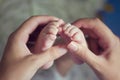 Little baby feet with mother hand Royalty Free Stock Photo