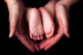 Little baby feet in mother`s hands Royalty Free Stock Photo