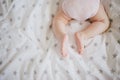 Little baby feet on a swaddle blanket