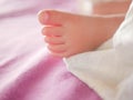 Little baby feet. Theres nothing quite so sweet as tiny little baby feet. Little baby boy on bed. Close up. Space for copy