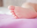 Little baby feet. Theres nothing quite so sweet as tiny little baby feet. Little baby boy on bed. Close up. Space for copy