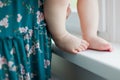 Little baby feet and woman Royalty Free Stock Photo