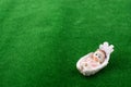 Little baby figure in in a cradle Royalty Free Stock Photo