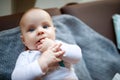 Little baby with fingers in mouth Royalty Free Stock Photo