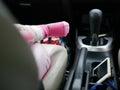 Little baby foot is near a driving car transmission Royalty Free Stock Photo