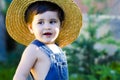 Little baby gardener smiling