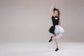 Little baby girl ballerina dancing in black and white clothing smiling having positive emotion Royalty Free Stock Photo