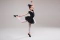 Little baby girl ballerina dancing in black and white clothing smiling having positive emotion Royalty Free Stock Photo