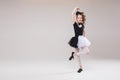 Little baby girl ballerina dancing in black and white clothing smiling having positive emotion Royalty Free Stock Photo