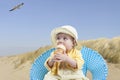 Little baby girl at the beach eating ice cream Royalty Free Stock Photo