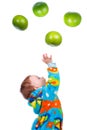 Little baby girl caughts fruits -grapefruit Royalty Free Stock Photo