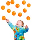 Little baby girl caughts orange Royalty Free Stock Photo