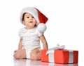 Little baby girl child in Santa hat with gift box Royalty Free Stock Photo