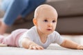 little baby girl crawling on floor at home Royalty Free Stock Photo