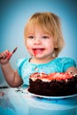 Little baby girl eating cake Royalty Free Stock Photo