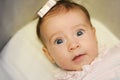Little baby girl with surprise expression on her face Royalty Free Stock Photo