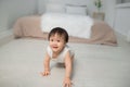 Little baby girl or girl crawling on floor in bed room Royalty Free Stock Photo