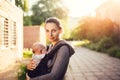 Little baby girl and her mother walking outside during sunset. M Royalty Free Stock Photo