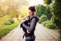 Little baby girl and her mother walking outside during sunset. M Royalty Free Stock Photo