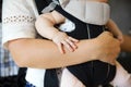 Little baby girl holding the hand on mother's arm Royalty Free Stock Photo