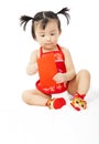 Little baby girl holding a red envelope for chinese new year Royalty Free Stock Photo