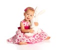 Little baby girl hugging a toy bunny rabbit on white Royalty Free Stock Photo