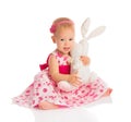 Little baby girl hugging a toy bunny rabbit on white Royalty Free Stock Photo