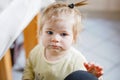 Little baby girl learning walking, standing and making first steps at home. Toddler balancing. Happy child, balance and Royalty Free Stock Photo