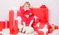 Little baby girl play near pile of gift boxes. Family holiday. Things to do with toddlers at christmas. Christmas gifts Royalty Free Stock Photo