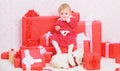 Little baby girl play near pile of gift boxes. Family holiday. Things to do with toddlers at christmas. Christmas gifts Royalty Free Stock Photo