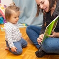 Baby Girl. Reading. Mother. Book. Joy Royalty Free Stock Photo