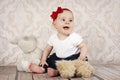 Little baby girl playing with plush toys Royalty Free Stock Photo