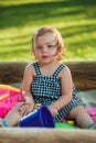 The little baby girl playing toys in sand Royalty Free Stock Photo