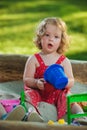 The little baby girl playing toys in sand Royalty Free Stock Photo