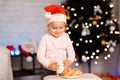Little baby girl preparing milk and cookies for Santa Claus Royalty Free Stock Photo