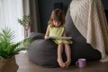 Little baby girl reading a book at home Royalty Free Stock Photo