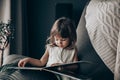 Little baby girl reading a book at home Royalty Free Stock Photo