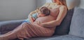 Little baby girl relaxing on mom`s pregnant belly - Pregnant mother with a toddler - Family concept Royalty Free Stock Photo