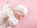 Little baby girl sleeping dressed in white suit Royalty Free Stock Photo