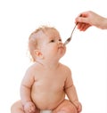 Little baby-girl spoon and parent's hand Royalty Free Stock Photo