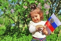 Little baby girl stands with flag of Russia Royalty Free Stock Photo