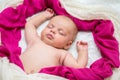 Little baby girl sweetly a sleep in pink scarves Royalty Free Stock Photo