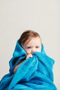 Little baby girl tucked in a cozy blue blanket. Royalty Free Stock Photo