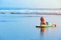 Young surfer girl with bodyboard has fun on sea beach Royalty Free Stock Photo