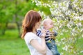 Little baby with her young mother in the garden Royalty Free Stock Photo